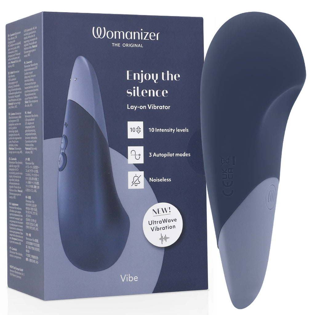 Vibromasseur clitoridien Womanizer Vibe bleu nuit, surface large et bords incurvés